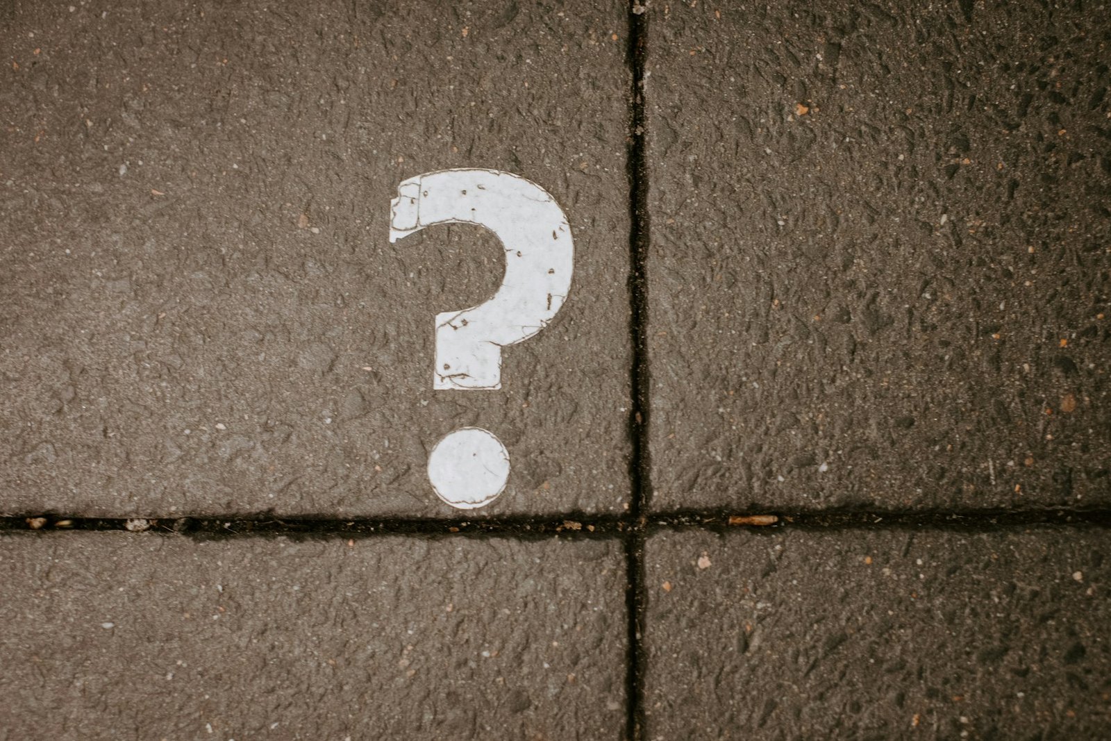 A question mark chalked on a board