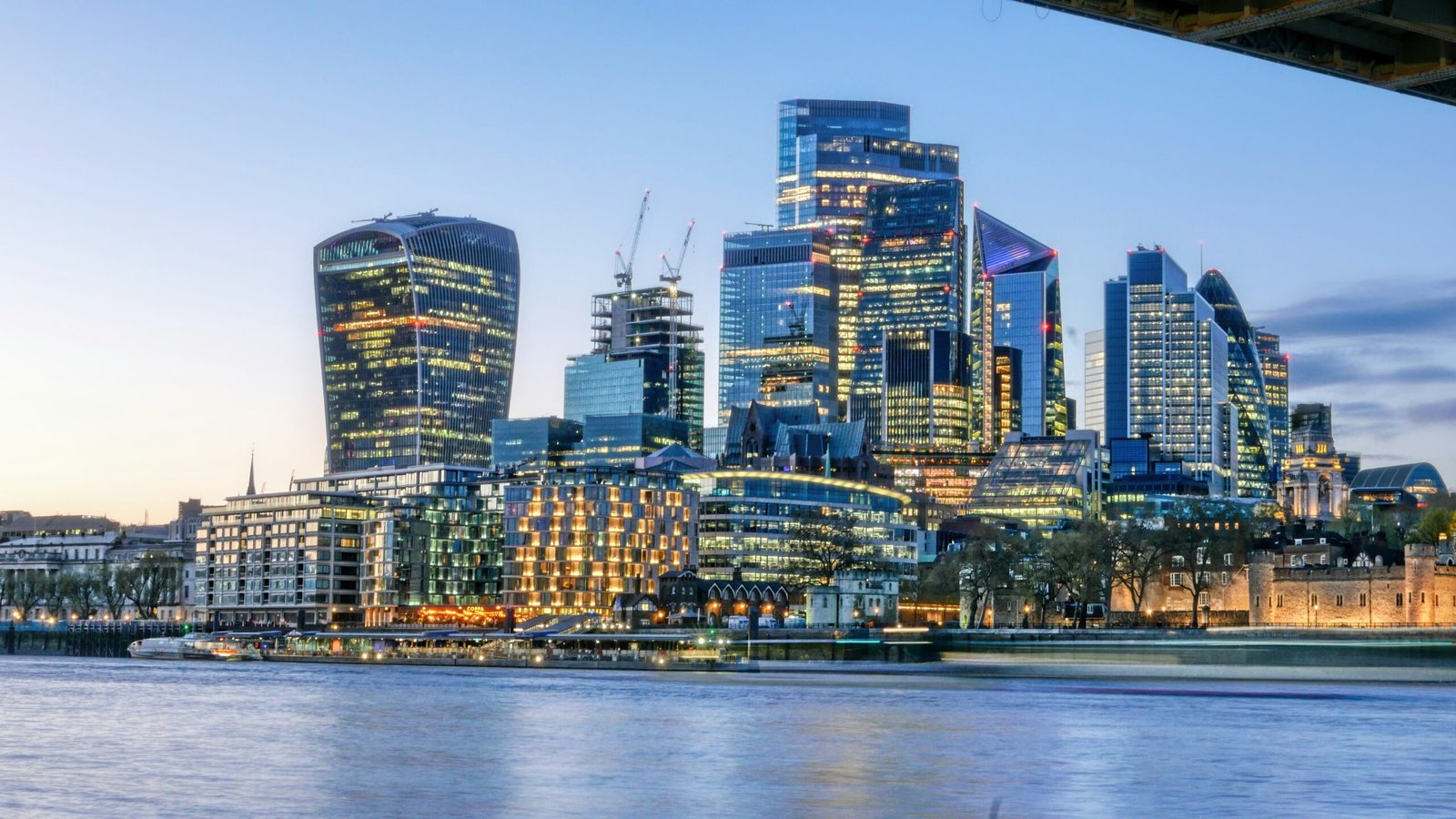 The City of London skyline at dusk, seen across the Thames